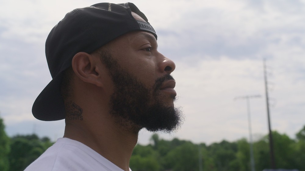 a profile of a man staring off into the distance