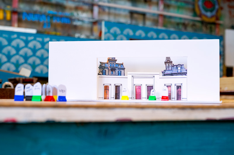 A model of a building for the Clue set decorated with colorful markers, showcasing various designs and patterns on its surface