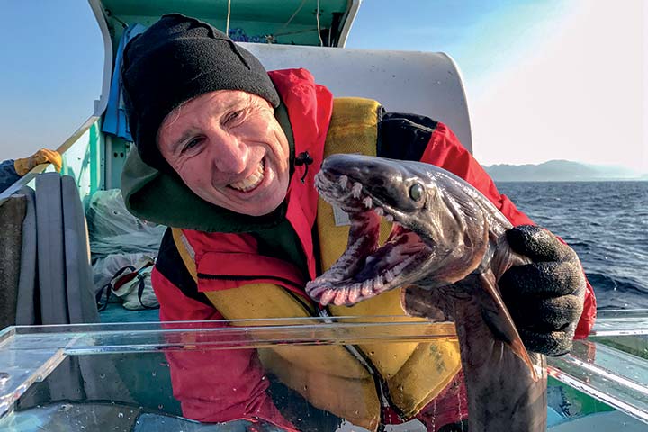 Dave holding a shark