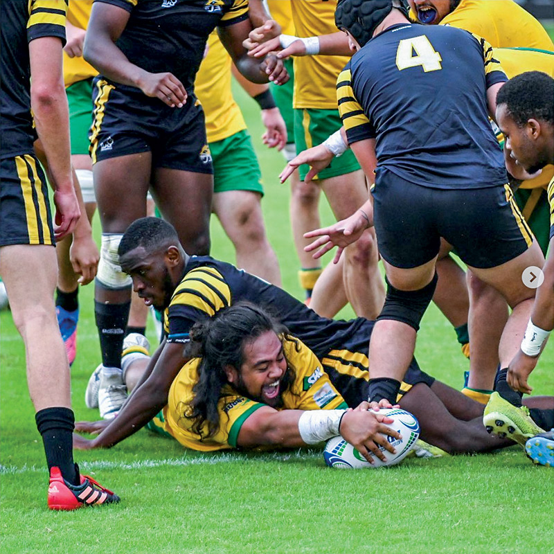 group of rugby players on the ground