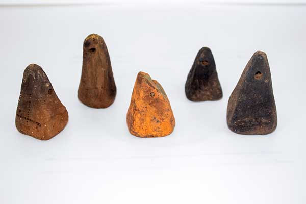 These artifacts, excavated in June 2025 at Gradishte, are thought to be loom weights—tools used to create textiles. They would have been tied to the ends of threads on warp-weighted looms to keep them taut and maintain tension during weaving. Photo by Ocean Song Edgar.