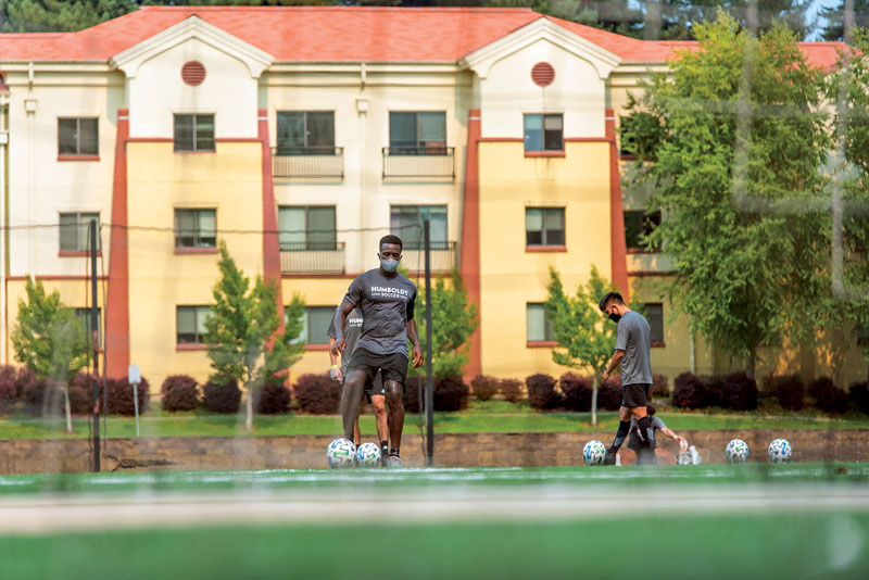 students play soccer