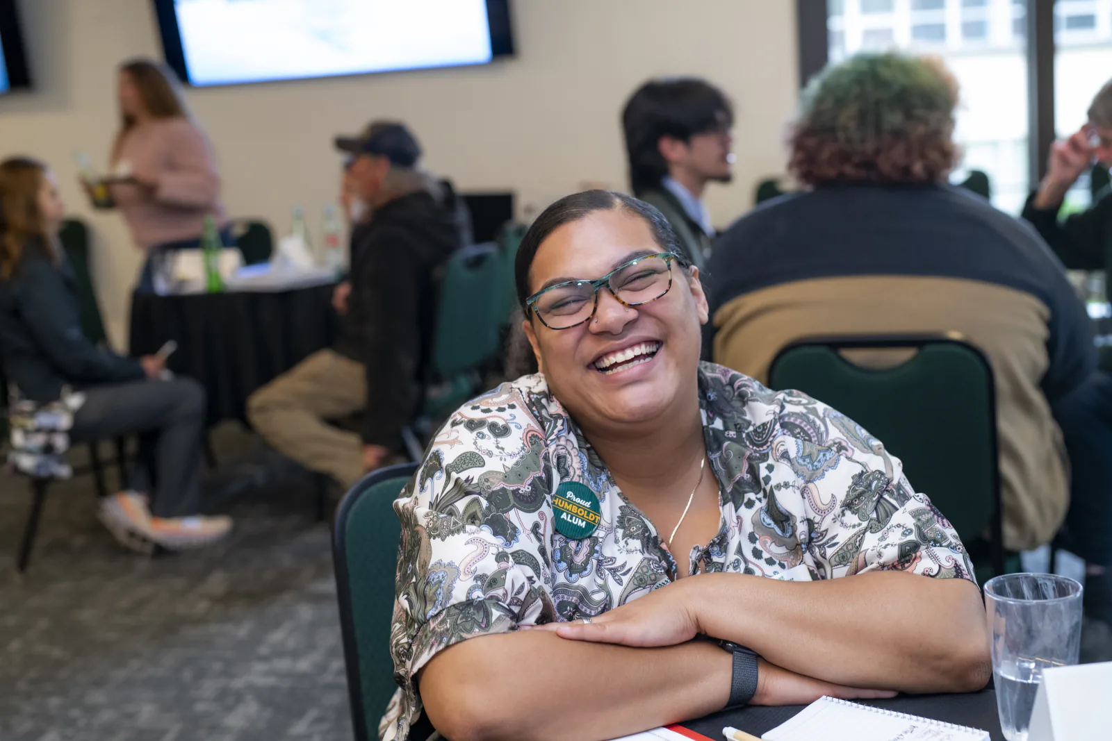 Christina Cois laughs during a conversation at the Alumni Connections event.