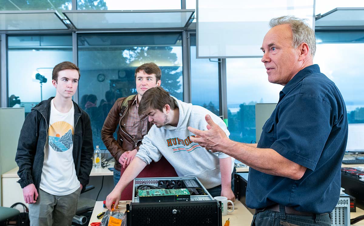 Professor and students in the computer lab