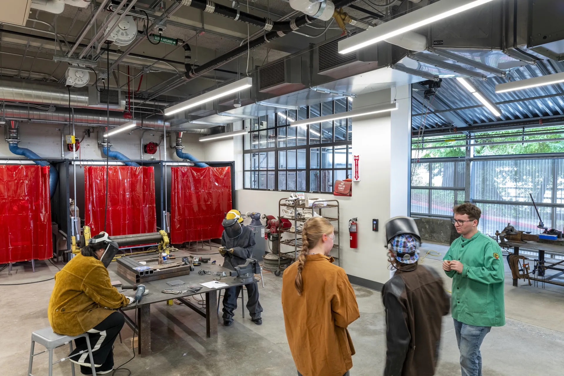 Students and an instructor working in the renovated Sculpture Lab