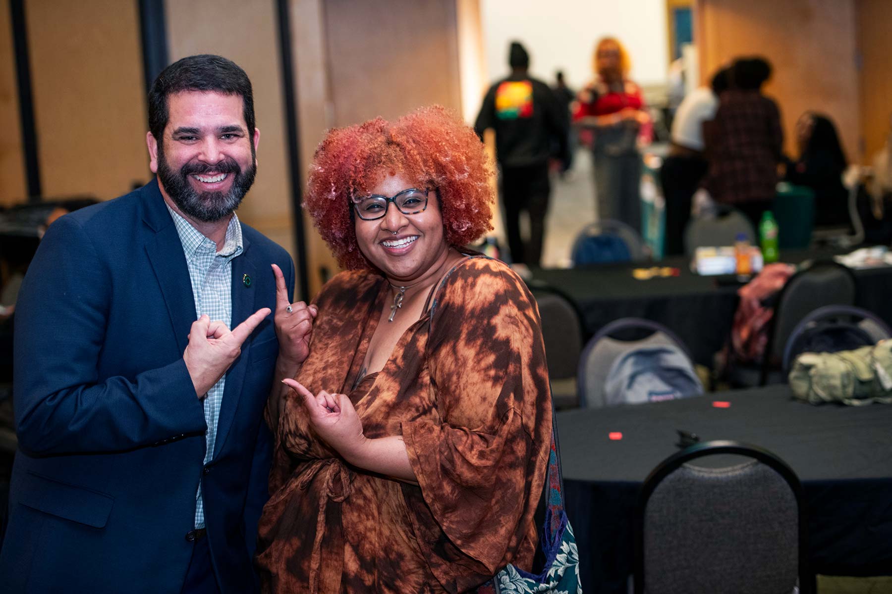 Richard Carvajal poses with a smiling event attende.