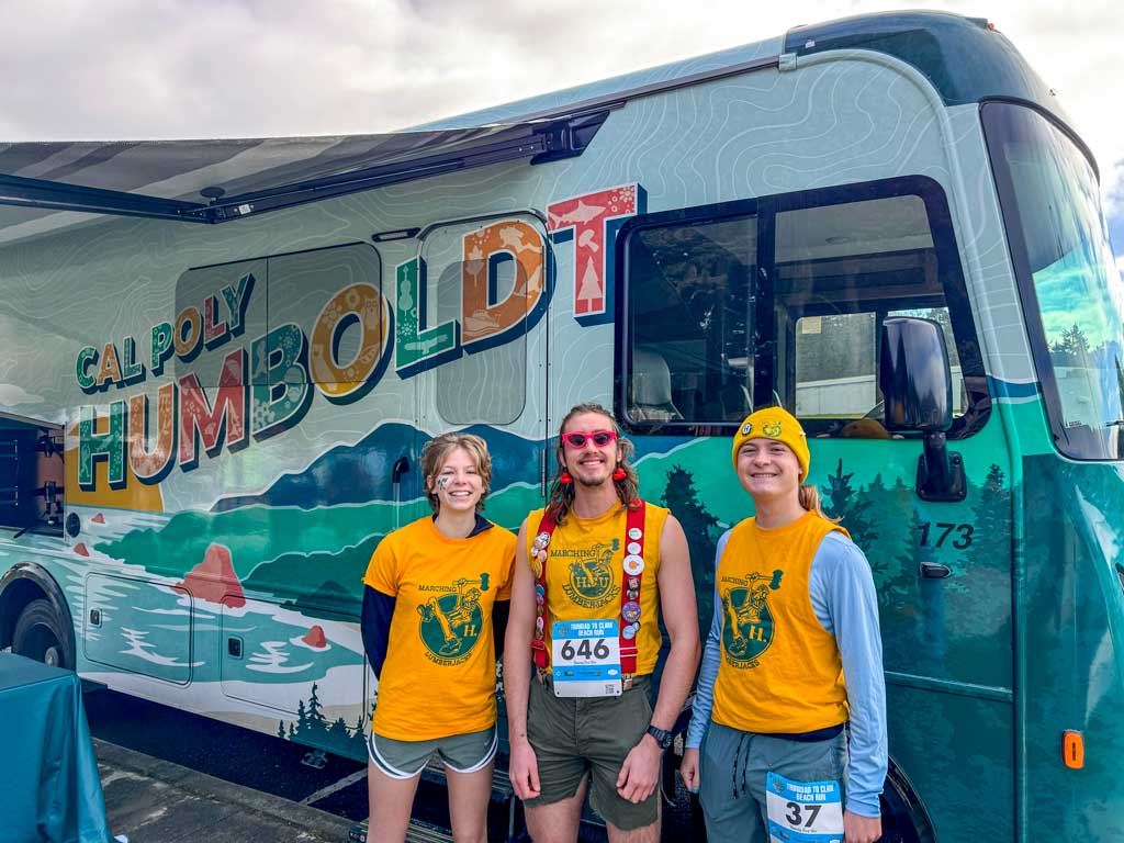 Runners standing in front of the RV at the Clam Beach Run
