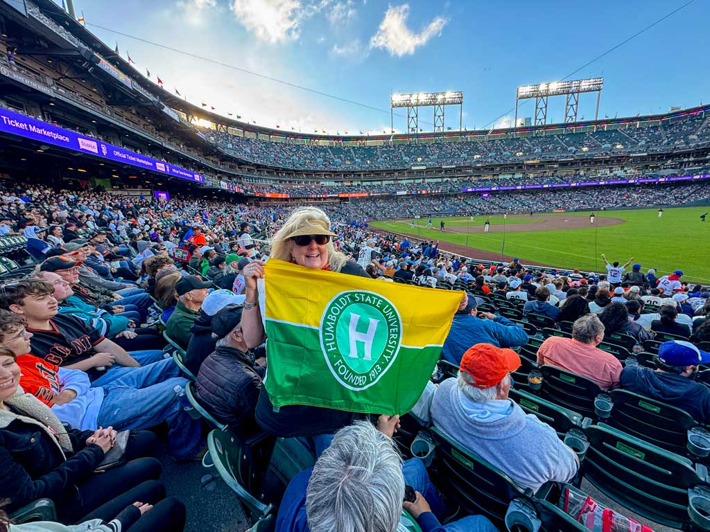 Fans celebrating at a the SF Giants game