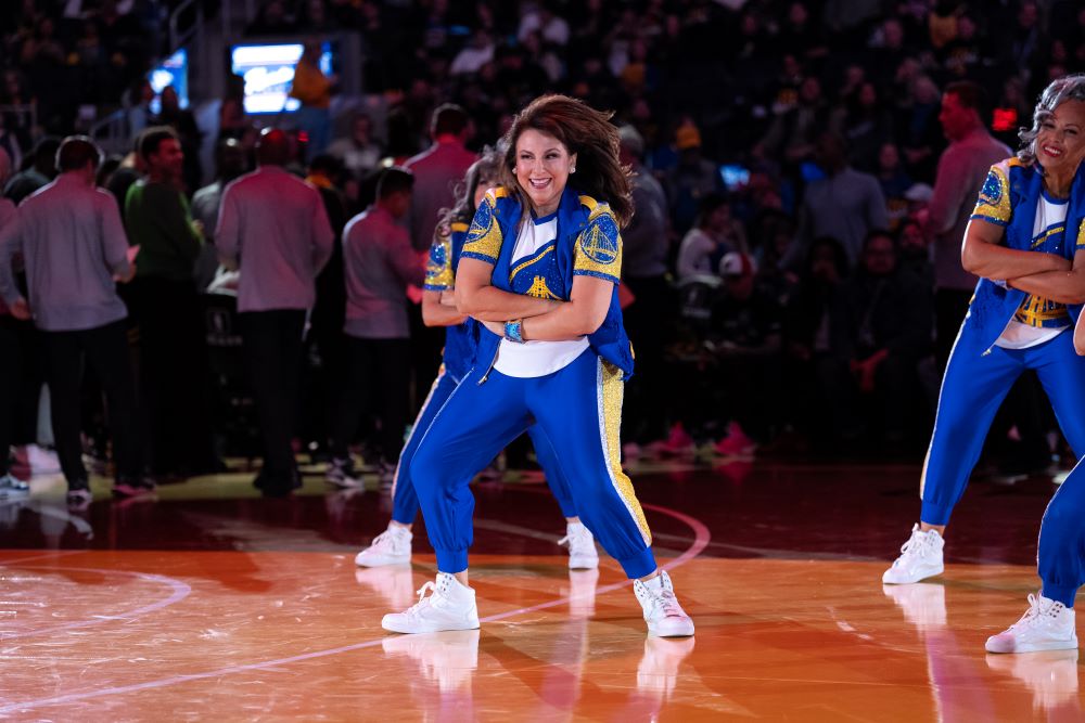 A photo of Liz Pimentel dancing at Chase Center