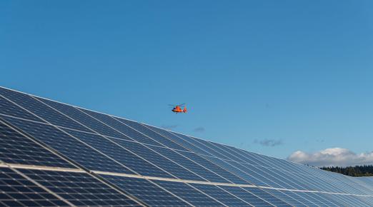 A Coast Guard helicopter lands at U.S. Coast Guard Air Station Humboldt Bay.