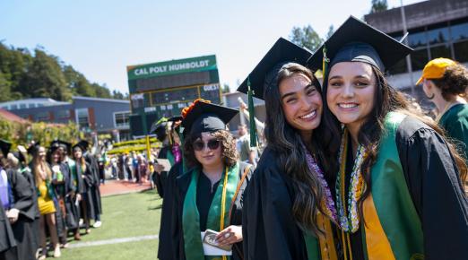 A photo of students at the Cal Poly Humboldt Commencement at the Redwood Bowl.