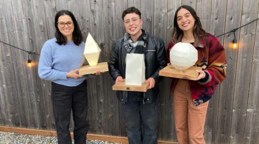 A photo (from left to right) of 2025 Sustainability Champion Award winners Cinthya Ammerman Muñoz, Karley Rojas, and Ash Hansen holding their awards.
