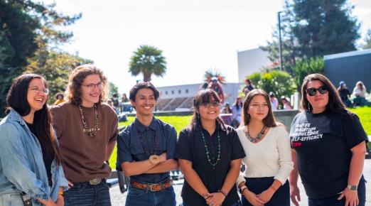 A photo of students and staff on the quad celebrating the kickoff of Indigenous People's Week.
