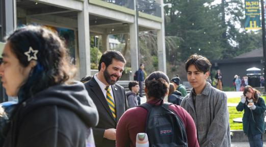 President Carvajal in quad talking with students