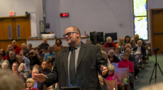 A photo of Jon Souza conducting