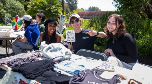 A photo of students tabling on the quad for the Earth Week Swap Meet. 