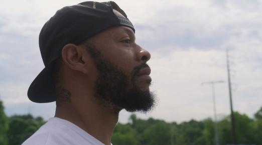 a profile of a man staring off into the distance
