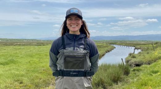 A photo of Farrah Tyler at Cannibal Island, which is a site in the Eel River Estuary that will undergo tidal marsh habitat restoration in 2027.