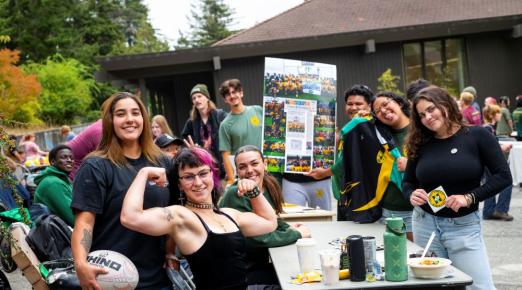 A photo of the Cal Poly Humboldt Women's Rugby team tabling during a club fair.