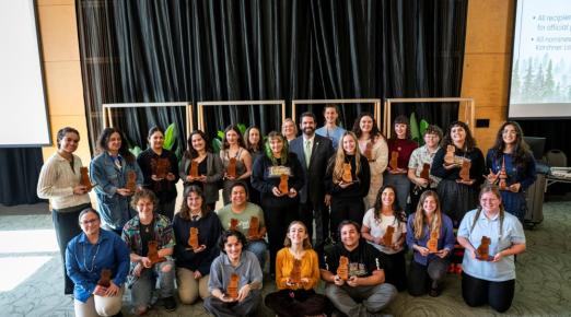 A group photo of all of the Outstanding Student Award winners with President Richard Carvajal. 
