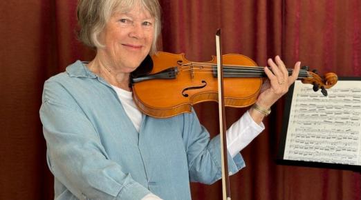 A photo of Julie Fulkerson with a violin