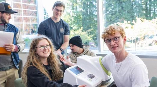 students taking a fellow student's blood pressure