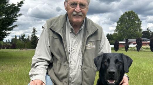 A photo of Terry Bowyers with his dog, Pippin,  taken in Estacada, Oregon.