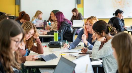 A photo of students studying in a classroom setting. 