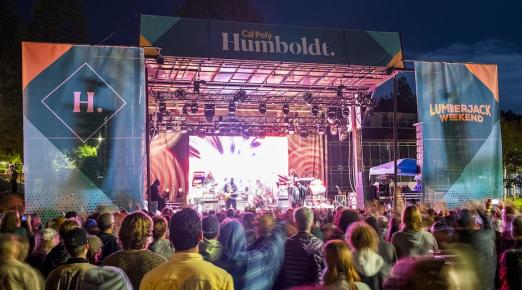 A photo of the stage and audience at Cal Poly Humboldt's Block Party. 