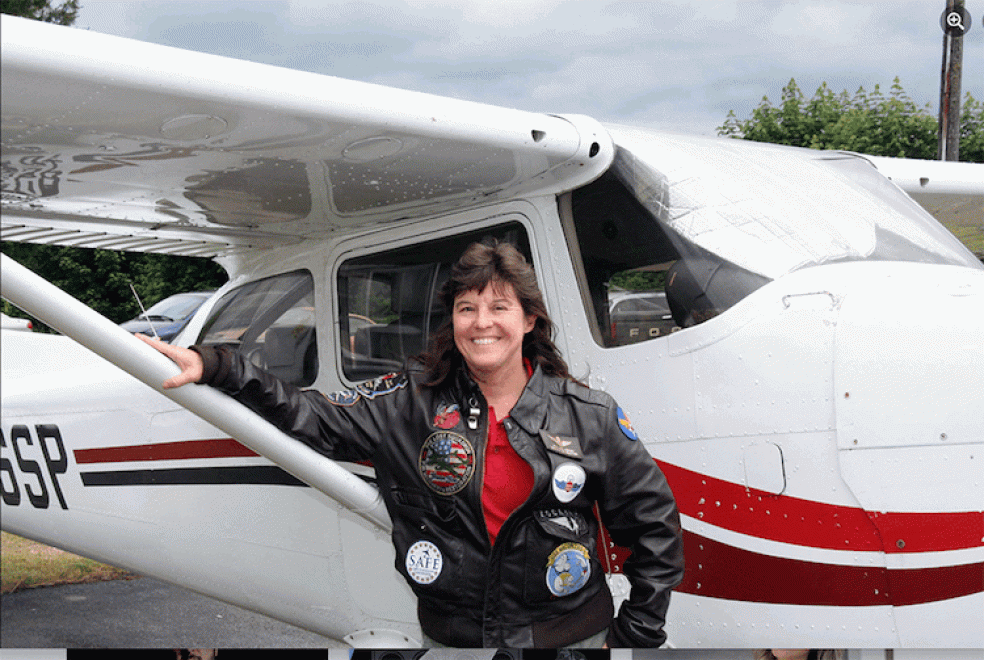 Meg Godlewski Meg Godlewski standing in front of a small plane.