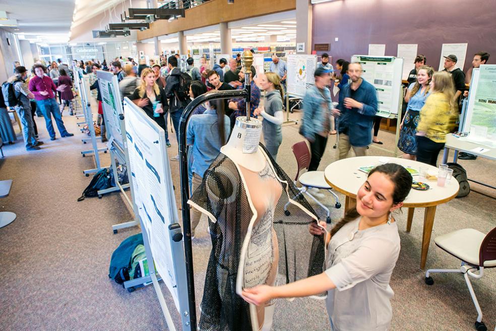 A student shows off a class project at ideaFest.