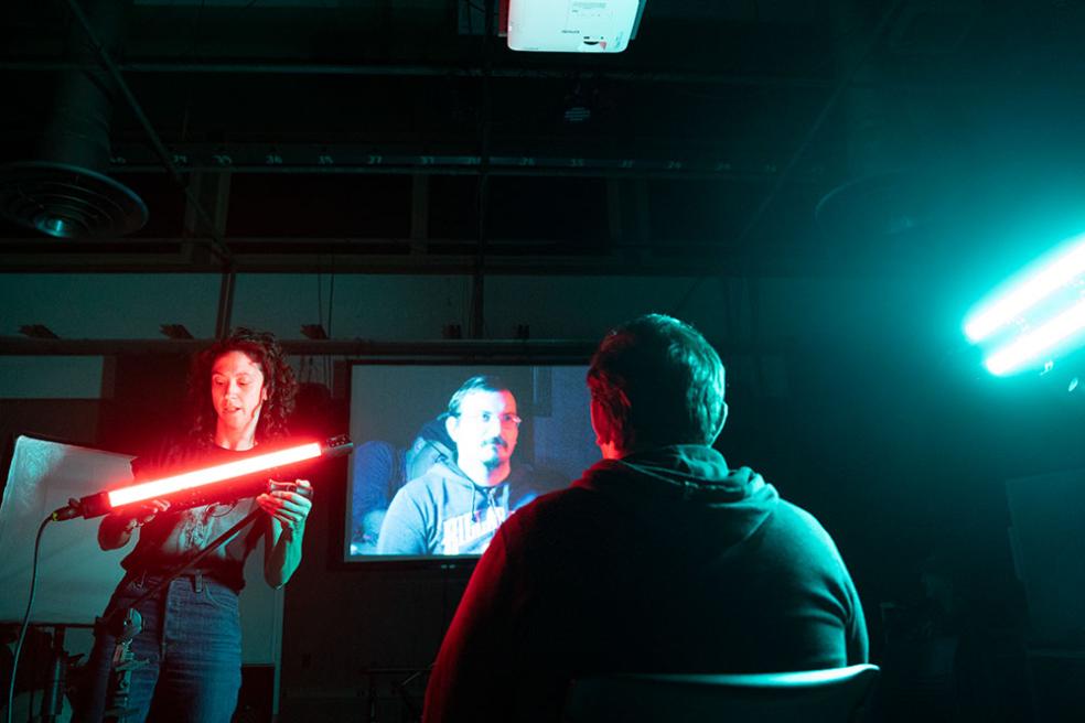 Film students demonstrate lighting in the studio.