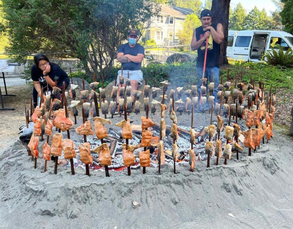 The first Salmon cooking pit in Cal Poly Humboldt’s history, held in the outdoor classroom space Wiyot Plaza. Bubba Riggins prepared and carried out the traditional salmon cook as part of the Native Women’s Collective Indigenous Girls, Young Women, and Femmes Volleyball and Empowerment Camp. Photo Credit: Cutcha Risling Baldy