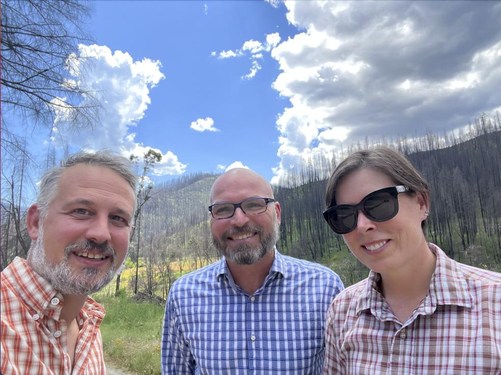 Jeff Kane (left), Benjamin Graham (center), and Erin Kelly (right) in summer 2022 at the edge of the 2020 Slater Fire near Happy Camp, California.