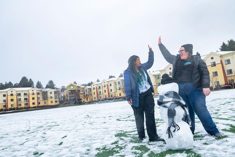 High fives after completing a snowperson