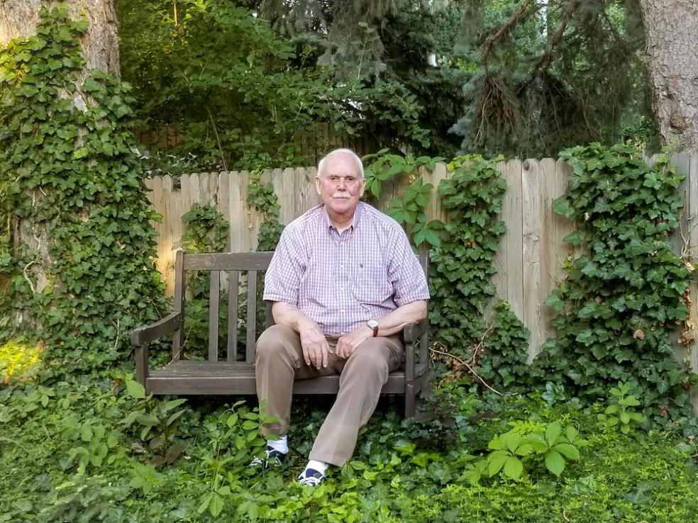 Rick Gardner sitting on a bench.
