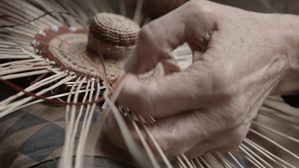 A film still showing basket weaving