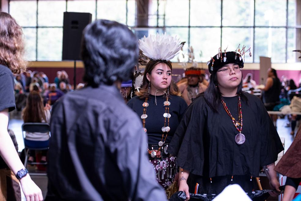 Shobe Britton (right), a double major in Child Development and Native American Studies and a member of the Covelo Round Valley Tribe at the 2023 Big Time.