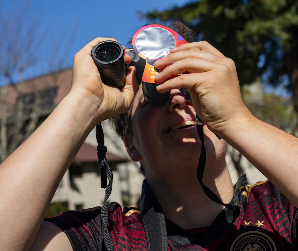 Taking a safe peek at the eclipse.