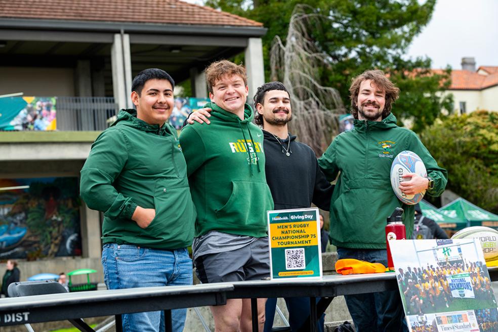A group photo of Humboldt's Men's Rugby Team at the Giving Day fundraising fair. 