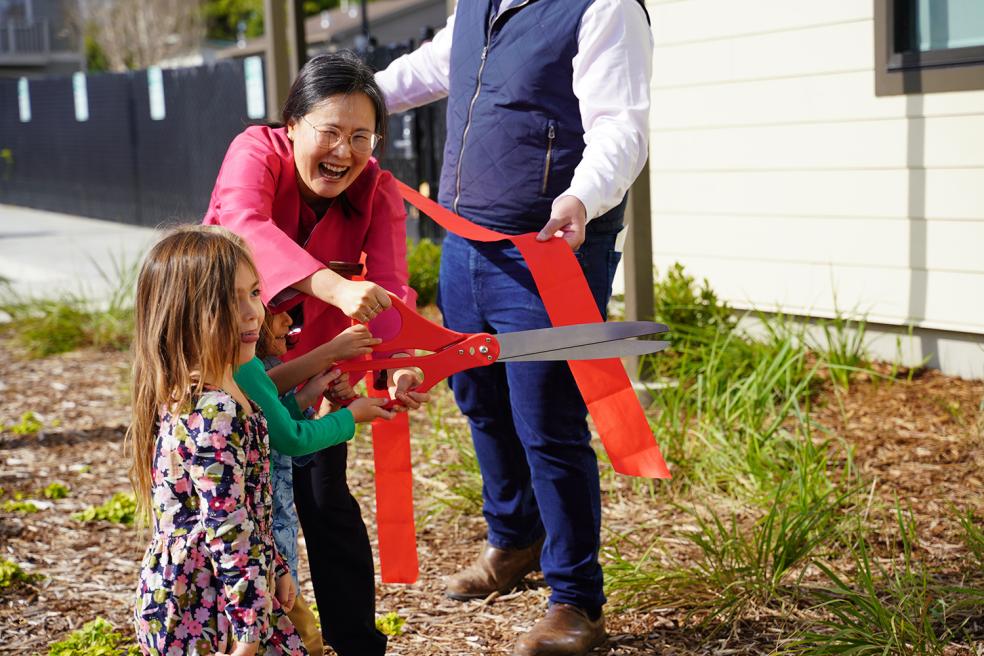 With help from Hyun-Kyung You, Cal Poly Humboldt Child Development professor and program leader for the Child Development Lab, kids cut the ribbon at the celebration of the Trinity Early Learning Center on Saturday, April 6.