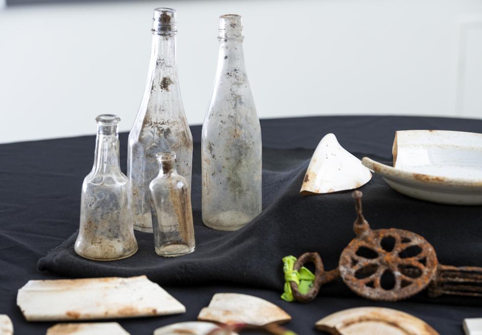 Glass bottles found at one of Falk’s cookhouses. Once used to serve condiments, they now serve as an important learning resource for students, who learn to date such items according to physical characteristics.