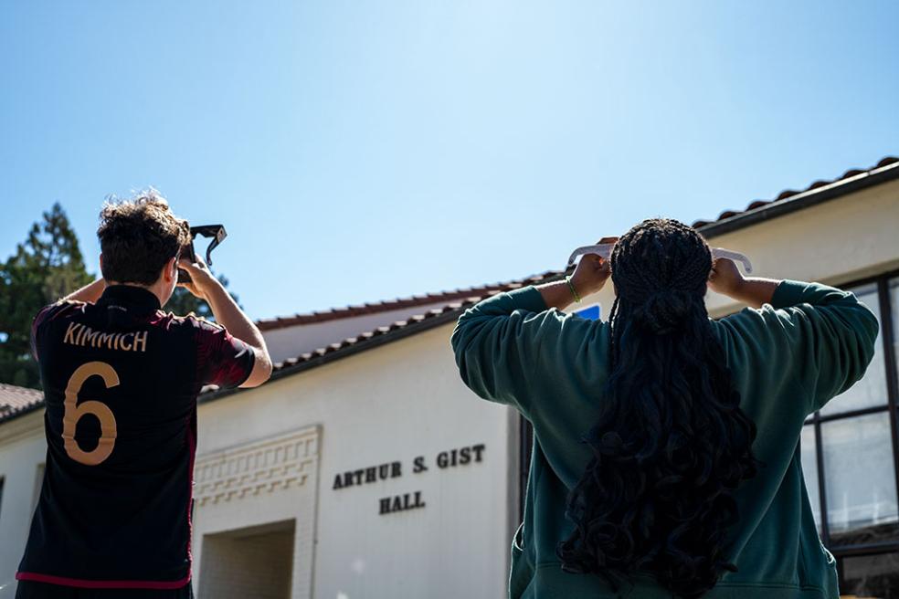 Students watched the eclipse peak locally at 11:16 a.m.