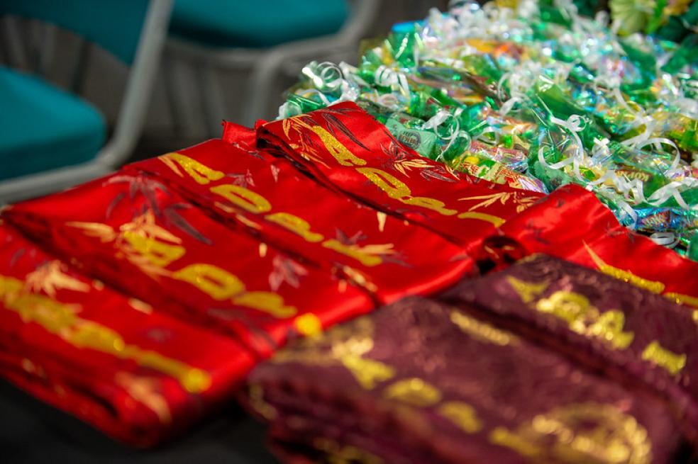 A photo of the ADPIC-MENA 2024 graduation sashes lined on a table. 