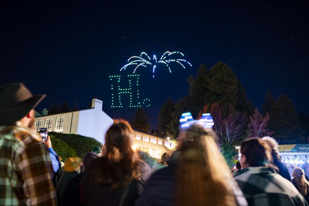 A photo of the Lumberjack Weekend drone show featuring Cal Poly Humboldt's iconic H dot logo. 