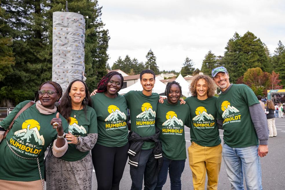 A photo of people wearing Lumberjack Weekend t-shirts. 