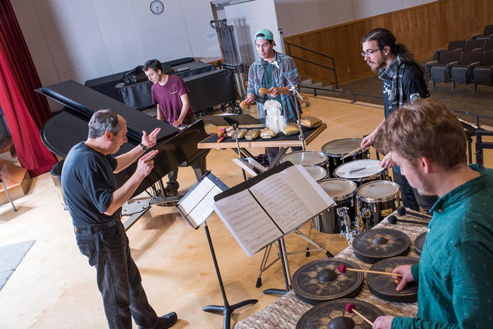 student practicing various percussion instruments 