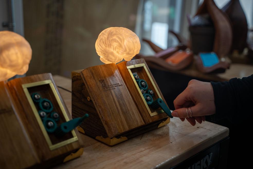 The Education trophy features functional gears and a brain that lights up when gears are turned.