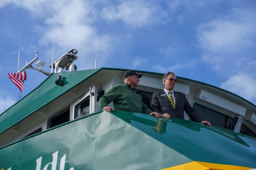A photo of College of Natural Resources &amp; Sciences Dean Eric Riggs and Cal Poly Humboldt Interim President Michael Spagna aboard the R/V North Wind.