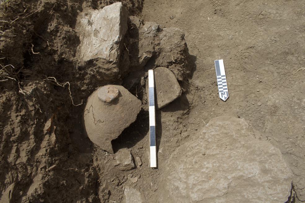 This feature was excavated in 2024 and represents a seed processing area with milling equipment and ceramic vessel carefully stored upside down for future use.  Relative dating places the artifacts into the early Bronze Age, likely close to 4,000 years old.